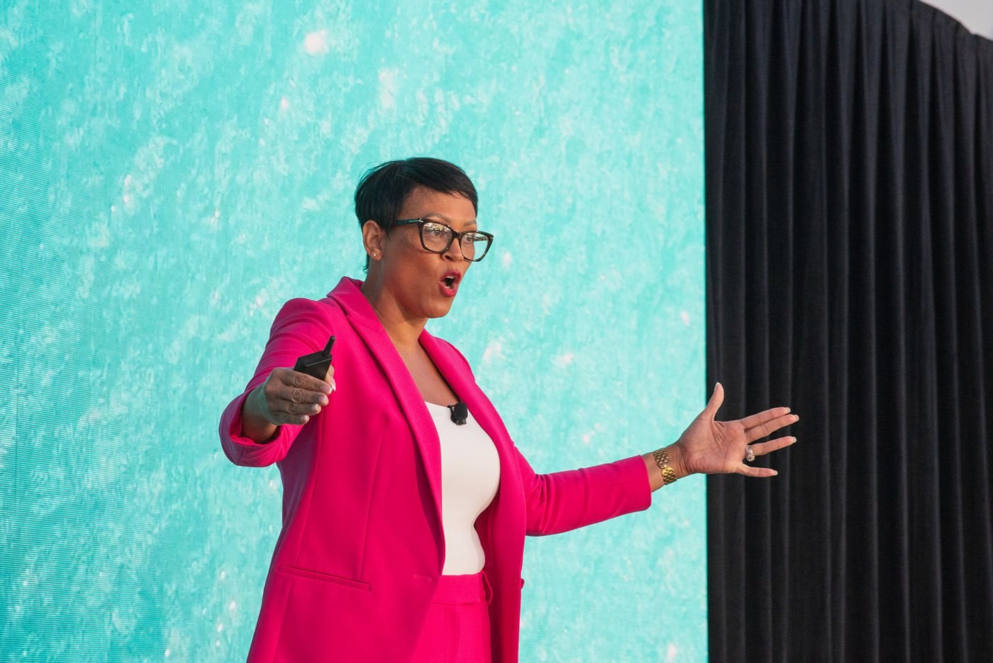 Lorrena Black on stage, arms open