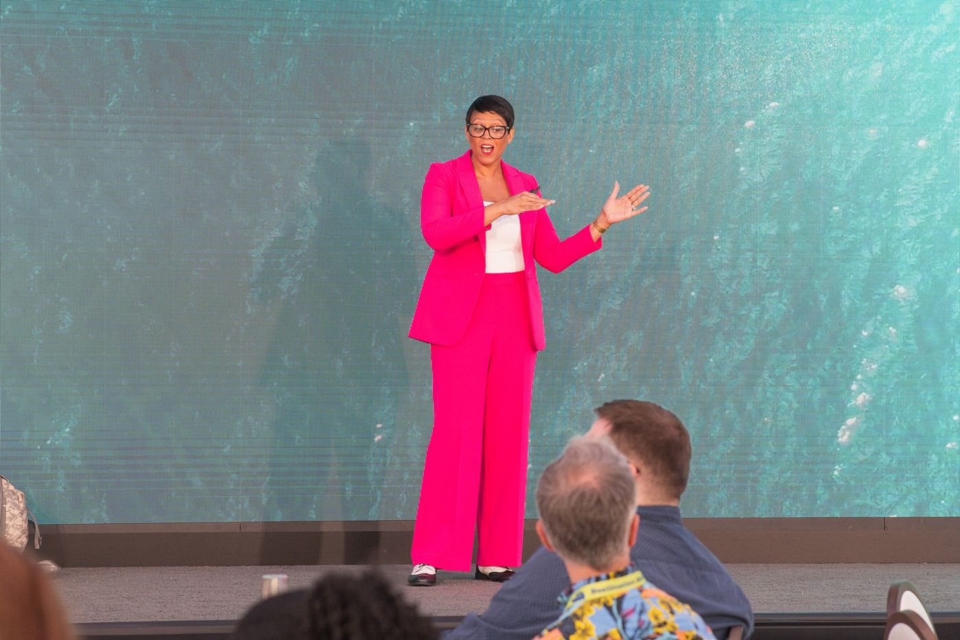Lorrena Black on stage in front of a conference audience
